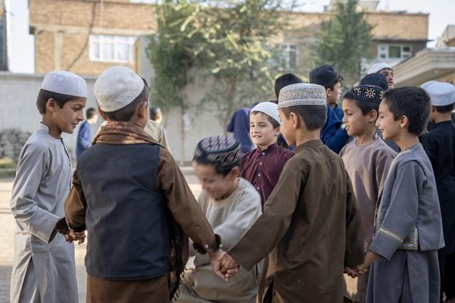 Children gathering and playing together outside