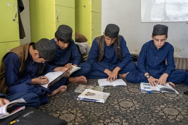 Students reading books together