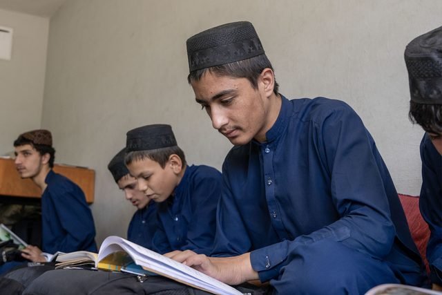 Students studying books together