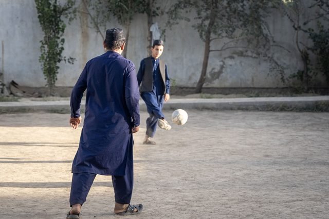 Children playing a ball game in the courtyard