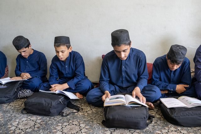 Students reading together indoors